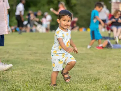 Close up of a young boy running around