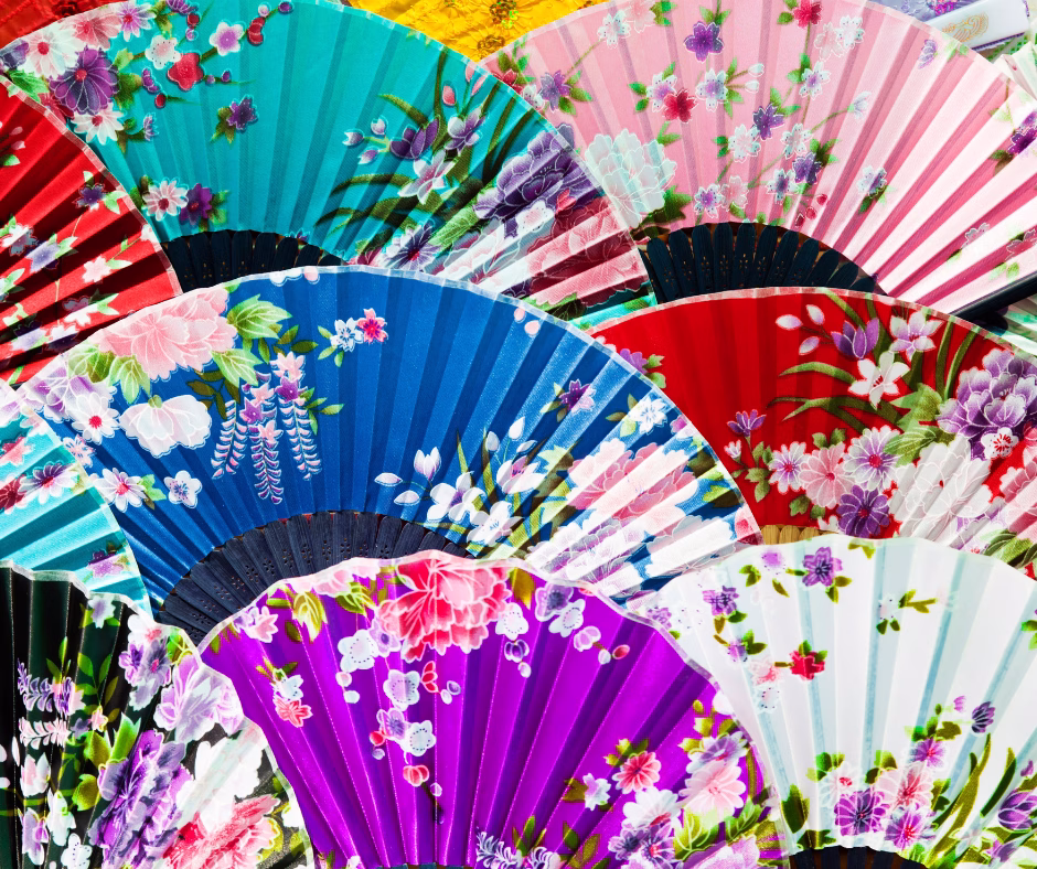 A collection of colorful fans with floral patterns