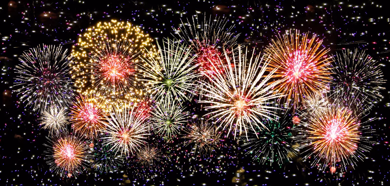 A vibrant display of fireworks exploding in the night sky, creating a kaleidoscope of colors and patterns.