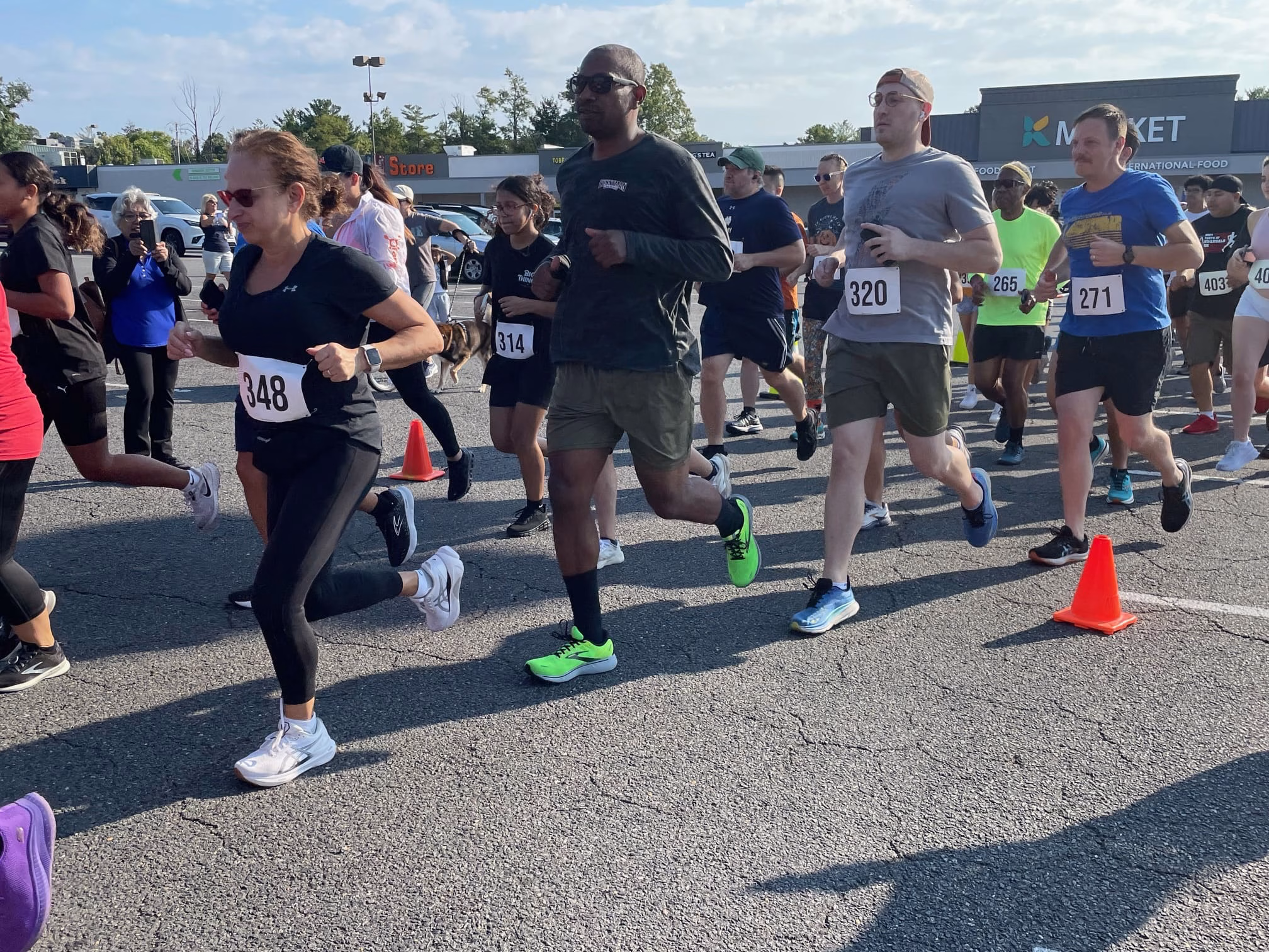 Group of people running in a parking lot