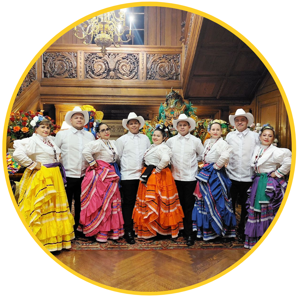 Group shot of dancers from Ballet Folklorico Boliviano Nuestras Raices in performance attire posing for camera.